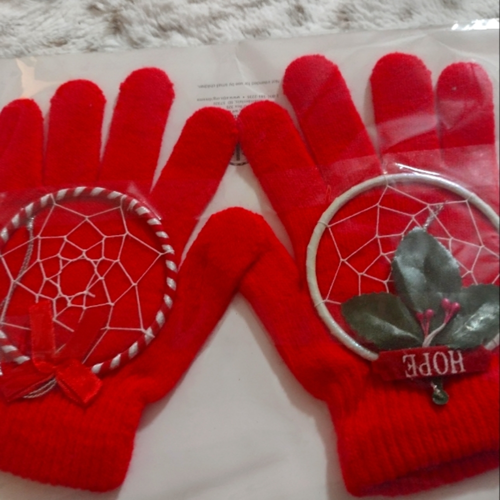 A pair of Red Gloves and 2 Holiday Ornaments that are Dream Catchers